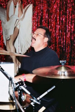 Jeff Cox behind the drum kit with The IMPACT Band